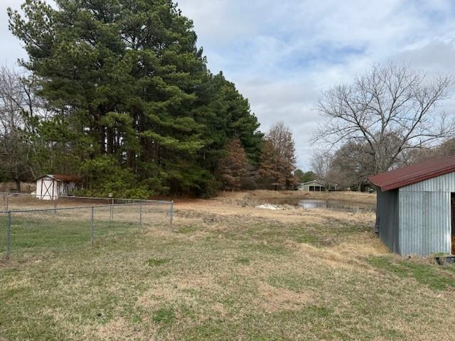 1525 Mansfield Road Reno, TX 75462 - Photo 18 of 34 a view of a yard with a tree
