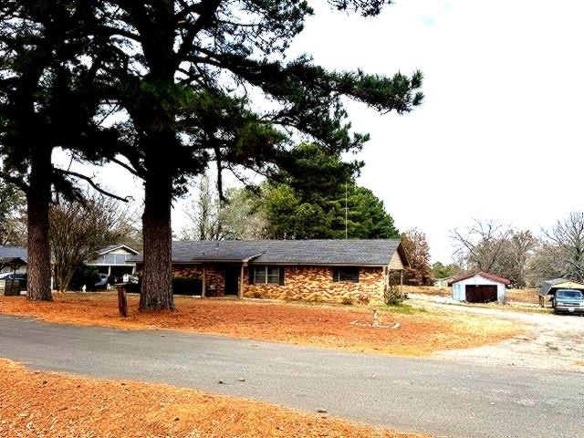 1525 Mansfield Road Reno, TX 75462 - Photo 2 of 34 a view of street with parked cars