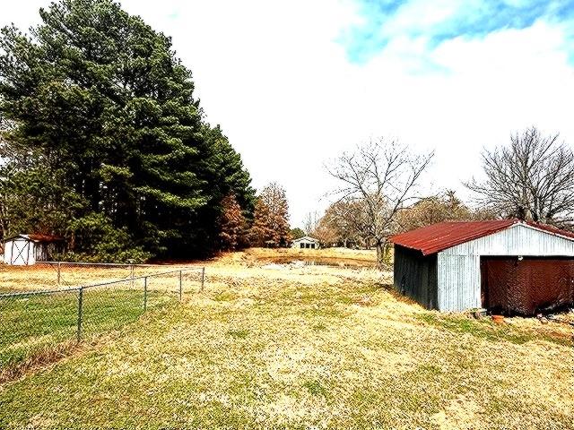 1525 Mansfield Road Reno, TX 75462 - Photo 27 of 34 a view of a yard with a tree