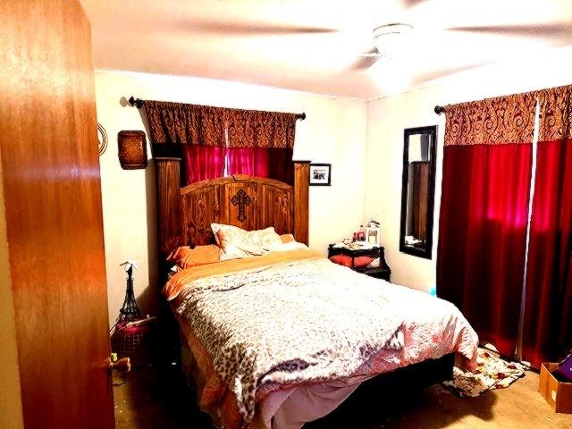 1525 Mansfield Road Reno, TX 75462 - Photo 29 of 34 a bedroom with a bed and a mirror