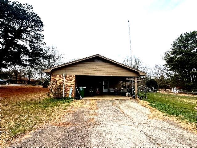 1525 Mansfield Road Reno, TX 75462 - Photo 3 of 34 a view of a house with yard and garage