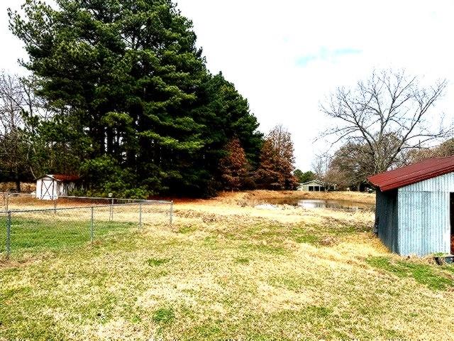 1525 Mansfield Road Reno, TX 75462 - Photo 32 of 34 a view of a yard with an outdoor space