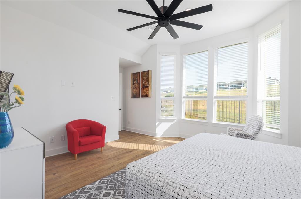 916 Willie Rnch Way Leander, TX 78641 - Photo 24 of 38 This bright room features wide plank flooring and a contemporary black ceiling fan