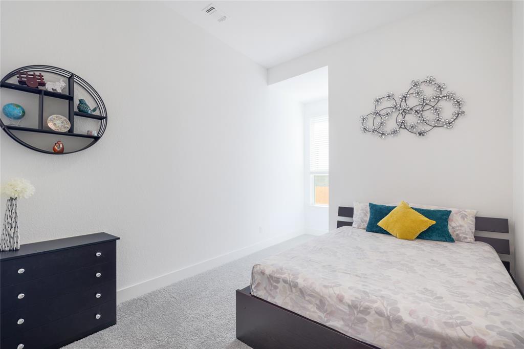 916 Willie Rnch Way Leander, TX 78641 - Photo 26 of 38 This room features light-colored carpeting, white walls, and a window providing natural light
