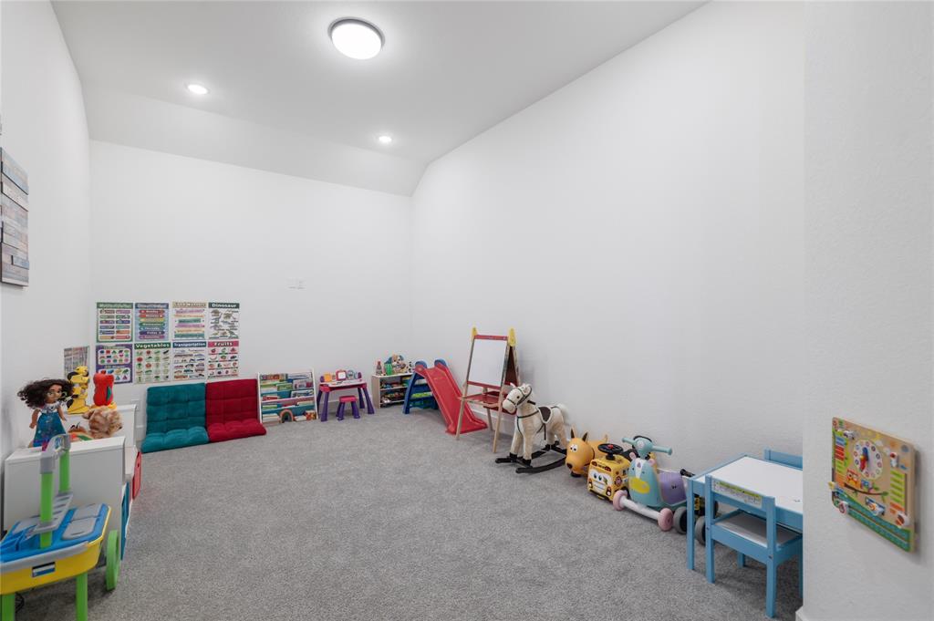 916 Willie Rnch Way Leander, TX 78641 - Photo 29 of 38 This versatile room offers neutral white walls, recessed lighting, and soft grey carpeting