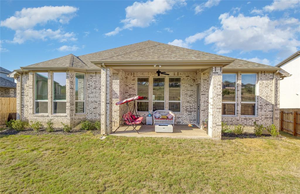 916 Willie Rnch Way Leander, TX 78641 - Photo 32 of 38 The property features a brick exterior with a covered patio area