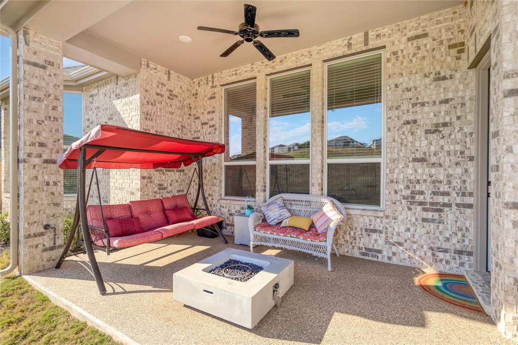 916 Willie Rnch Way Leander, TX 78641 - Photo 38 of 38 Covered patio area featuring a ceiling fan, brick exterior walls, and a concrete floor