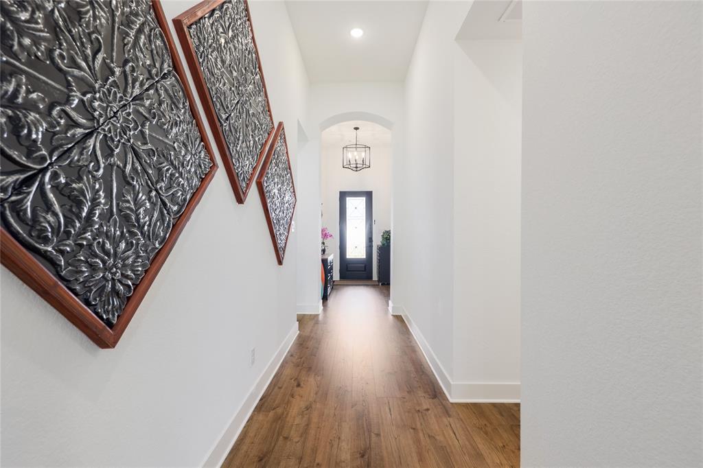 916 Willie Rnch Way Leander, TX 78641 - Photo 6 of 38 Entryway featuring hardwood floors, white walls, and a recessed light