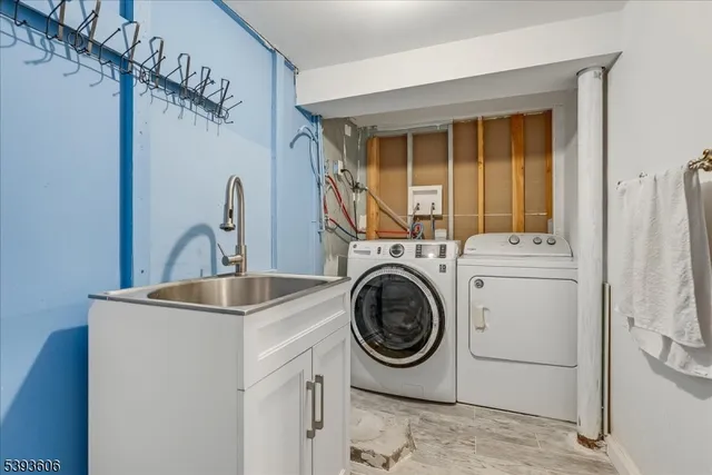 a living room with pool table and a fireplace