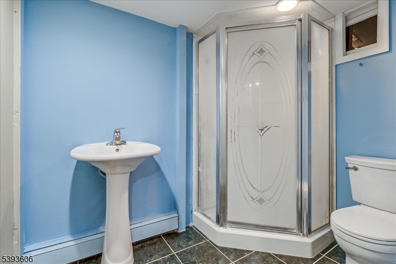 60 Kenvil Avenue Succasunna, NJ 07876 - Photo 23 of 28 a bathroom with a sink toilet and shower