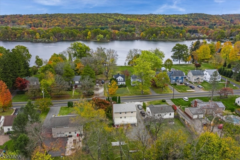 60 Kenvil Avenue Succasunna, NJ 07876 - Photo 3 of 28 an aerial view of residential houses with outdoor space and lake view