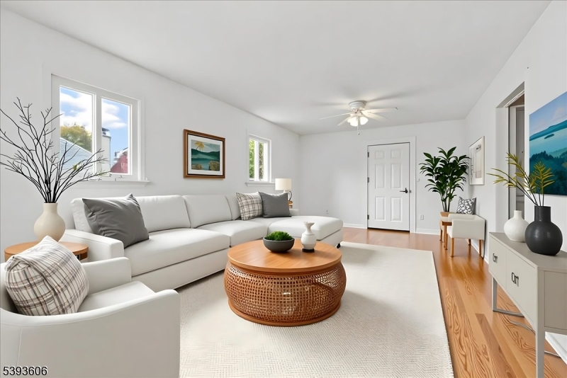60 Kenvil Avenue Succasunna, NJ 07876 - Photo 10 of 28 a living room with furniture and a potted plant