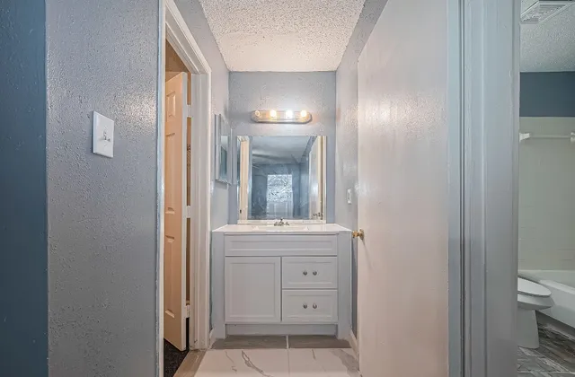 a view of an empty room with a fan