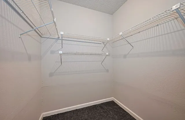 a view of a room with racks on the wall