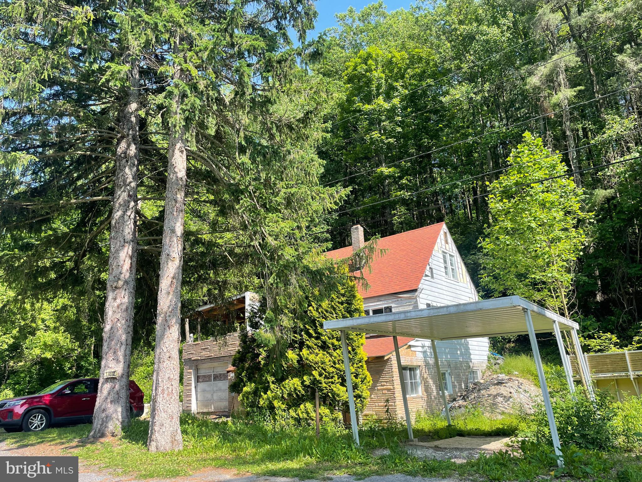 14602 Michael Road Northeast Cumberland, MD 21502 - Photo 2 of 20 a front view of a house with garden