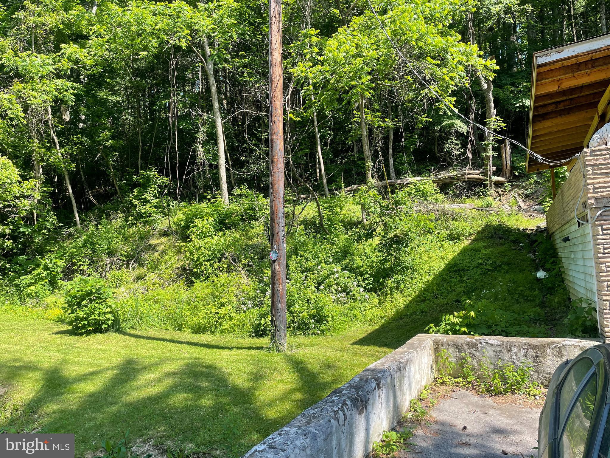 14602 Michael Road Northeast Cumberland, MD 21502 - Photo 7 of 20 a view of backyard with swimming pool and outdoor seating