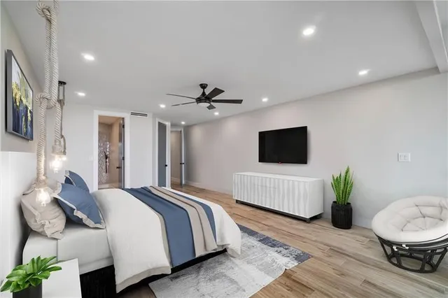 a spacious bedroom with a bed and a couch