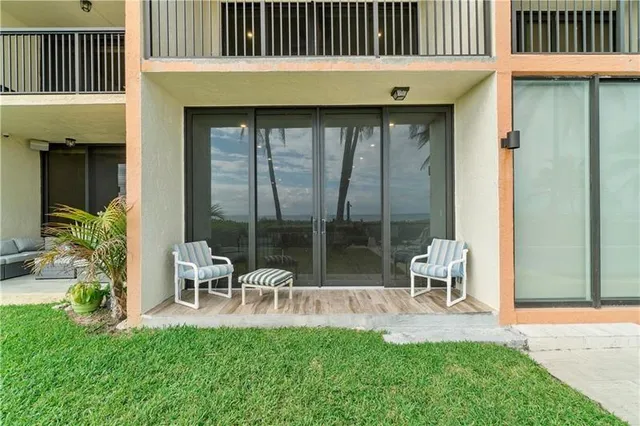 a view of swimming pool with a patio and a garden