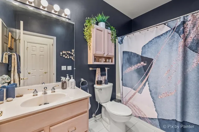 a bedroom with bed and window