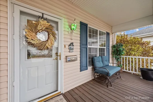 a front view of house with yard and trees around
