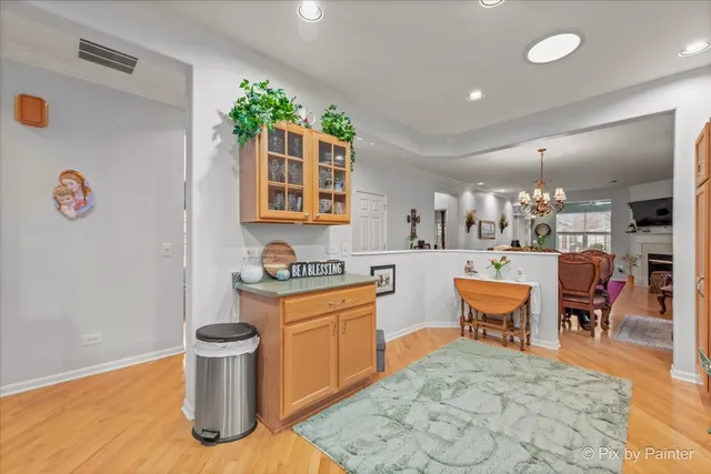 a kitchen with stainless steel appliances granite countertop a refrigerator sink and stove
