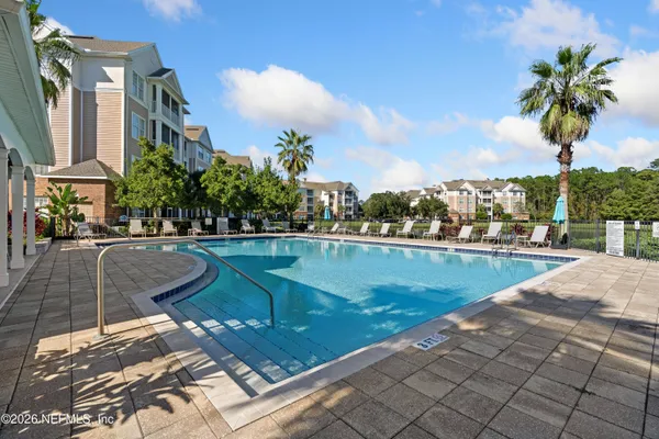 a view of a swimming pool with a terrace