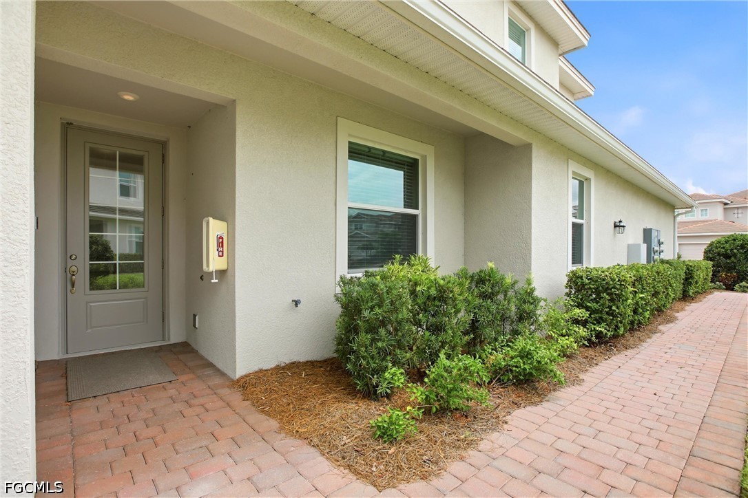 3751 Pebblebrook Ridge Court, Unit 101 Fort Myers, FL 33905 - Photo 32 of 48 a view of a house with potted plants