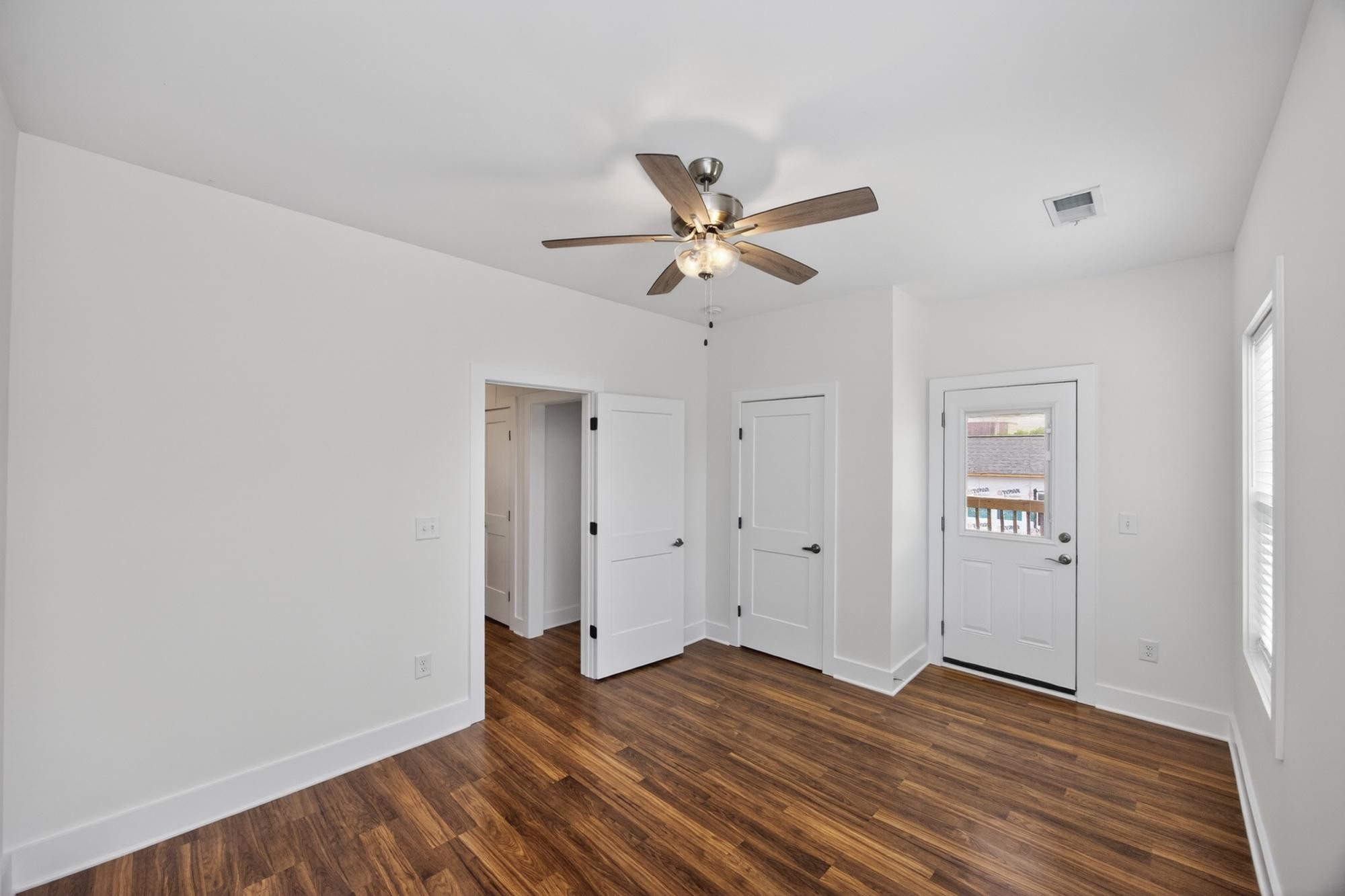 7 Decatur Street Nashville, TN 37210 - Photo 36 of 43 an empty room with wooden floor and ceiling fan