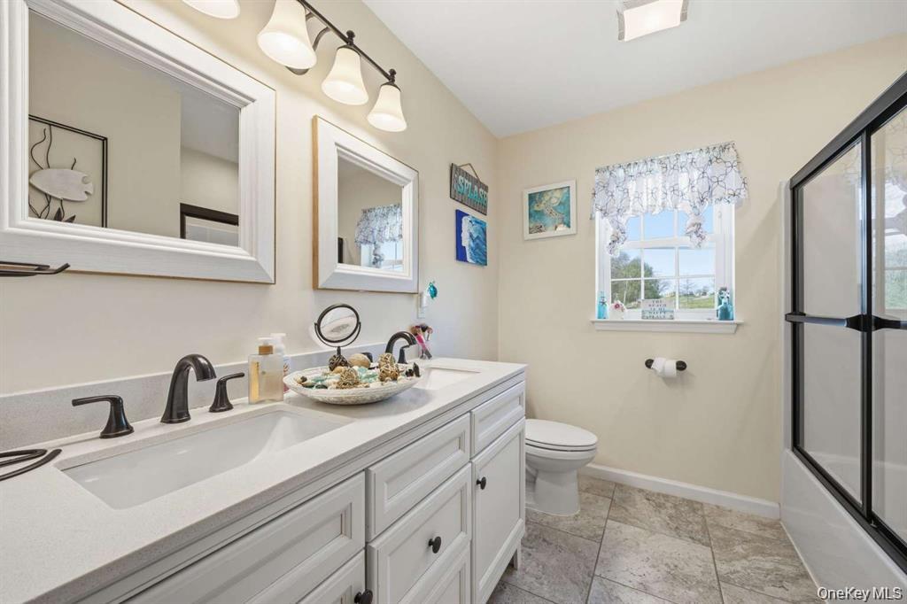 133 Old Chester Road Goshen, NY 10924 - Photo 23 of 33 a bathroom with a sink mirror vanity and toilet