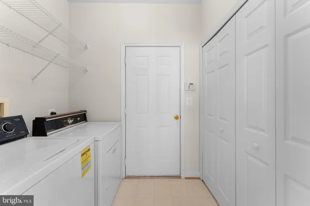 a kitchen with a white cabinets and white appliances