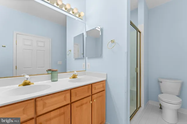 a bedroom with bed and a potted plant