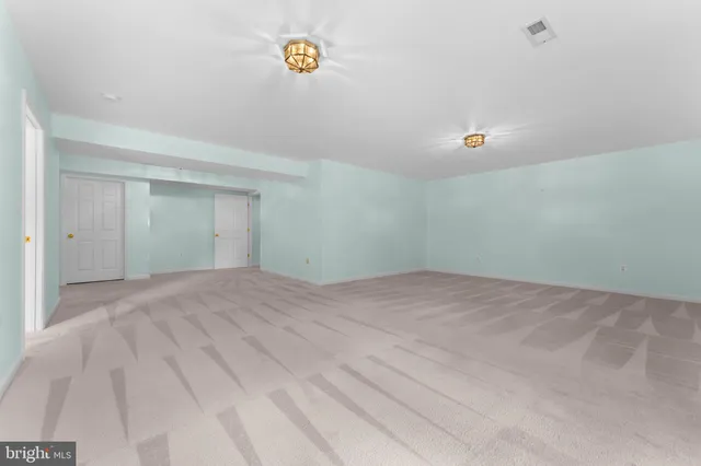 an empty room with a bathroom
