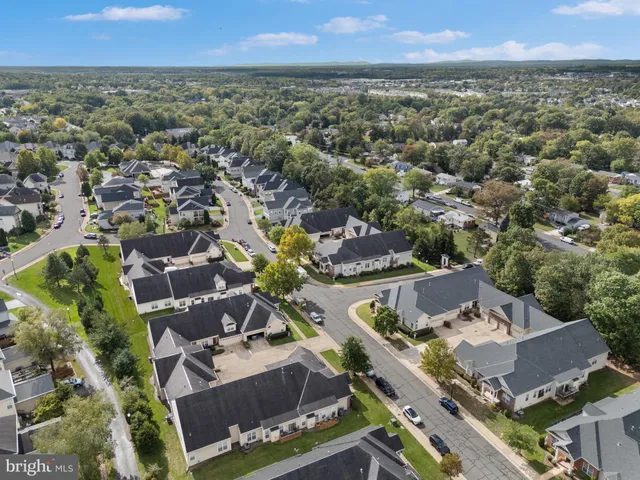 an aerial view of a house with a garden