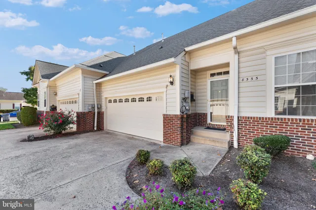 a view of an empty room with windows