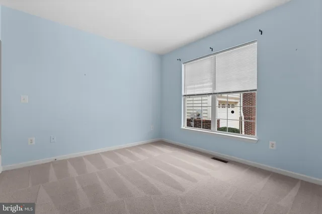 a view of hallway with wooden floor