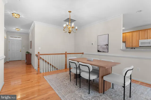a view of a livingroom with furniture wooden floor a fireplace