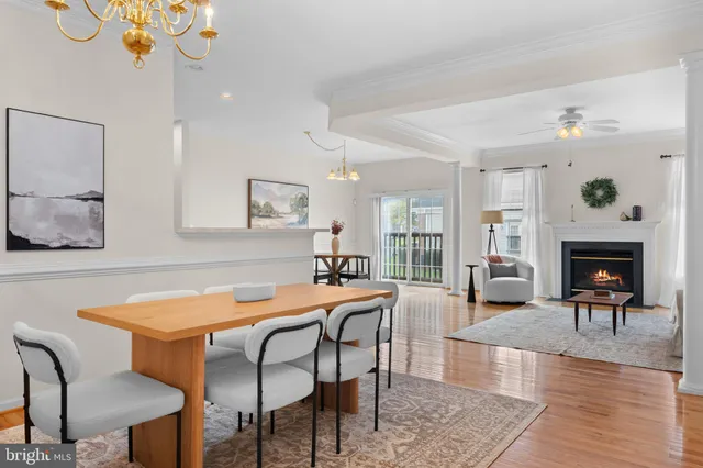 a view of a dining room with furniture and a chandelier