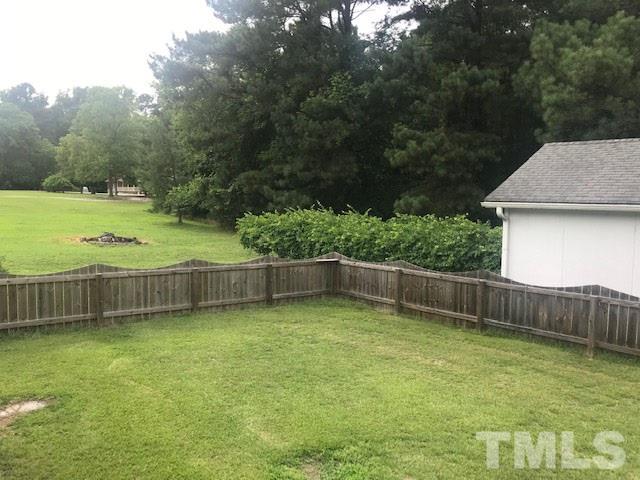 6529 Battle Bridge Road Raleigh, NC 27610 - Photo 3 of 3 Back yard, fire pit, lots of trees