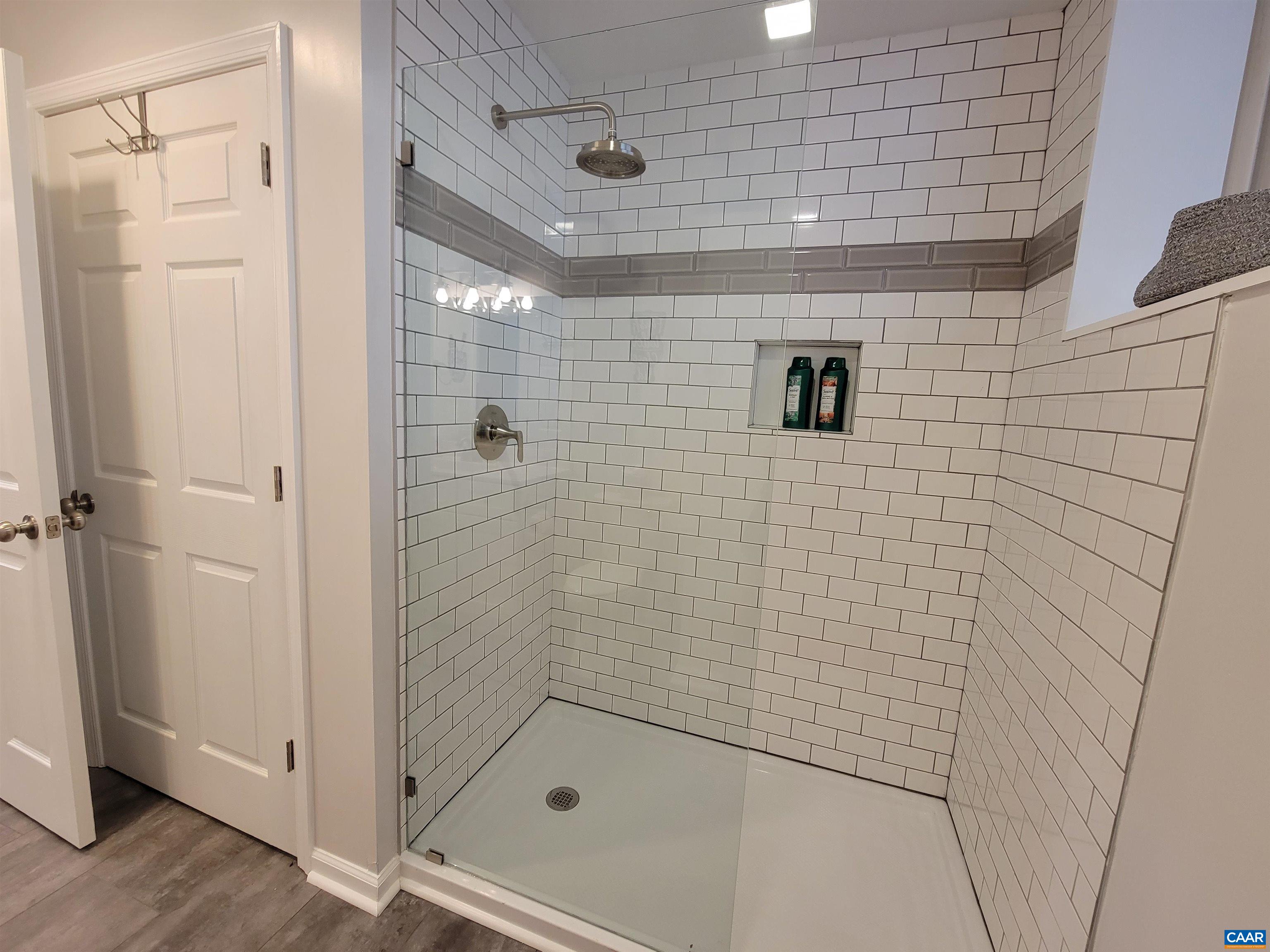 1511 East High Street, Unit 3 Charlottesville, VA 22902 - Photo 4 of 13 a bathroom with a shower