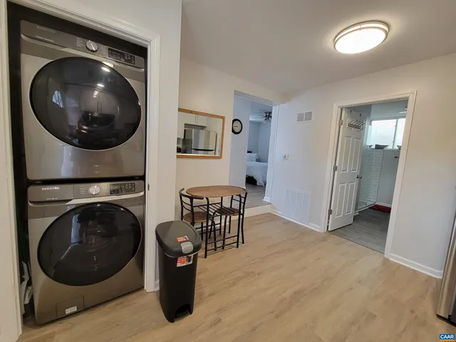 a view of a hallway with washer and dryer