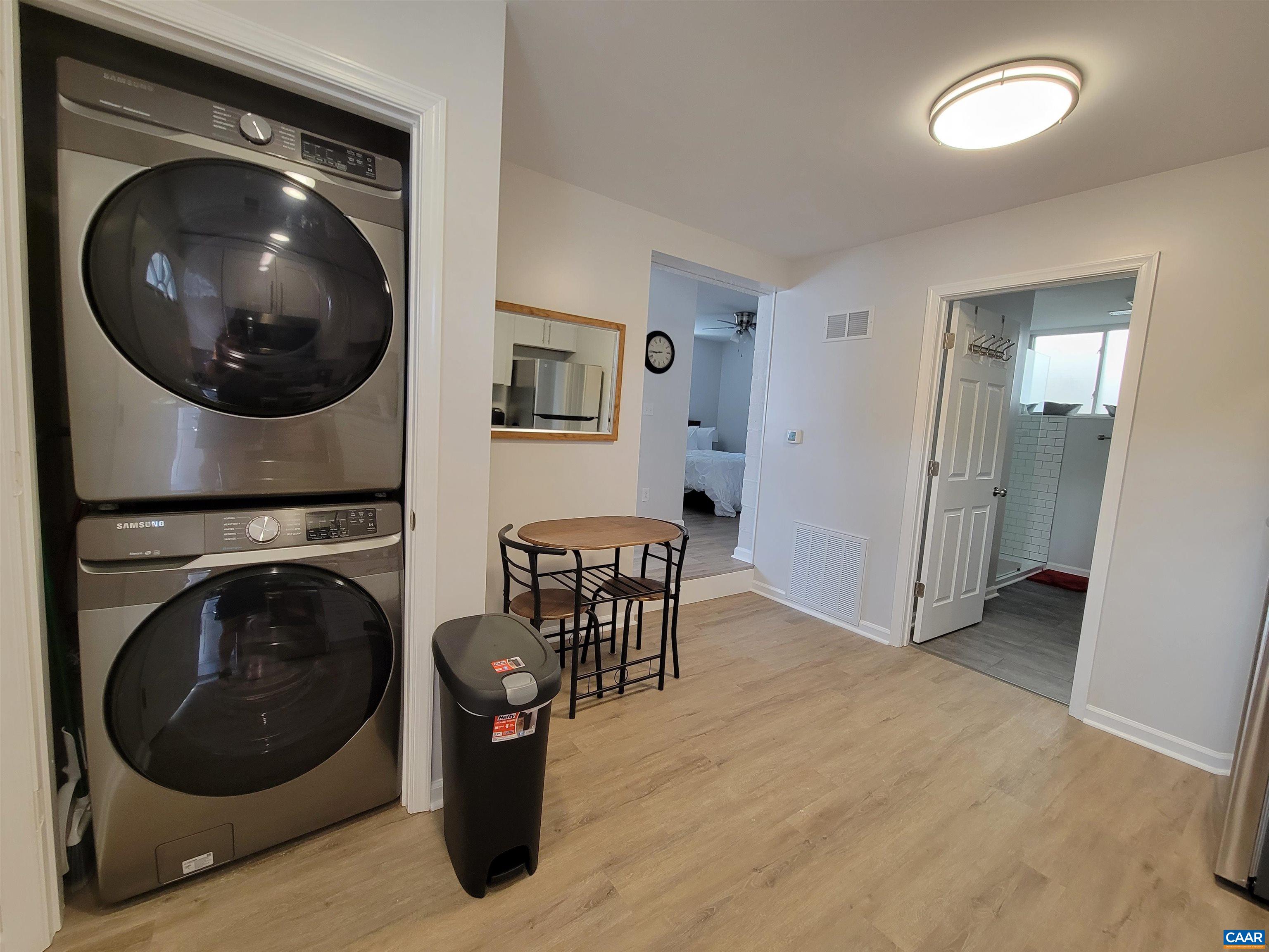 1511 East High Street, Unit 3 Charlottesville, VA 22902 - Photo 7 of 13 a view of a hallway with washer and dryer