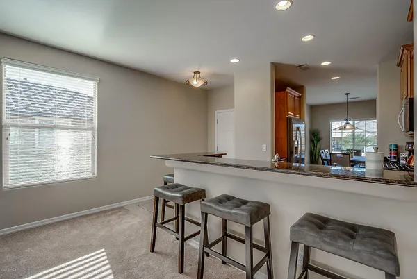 a view of a dining room with furniture window and outside view