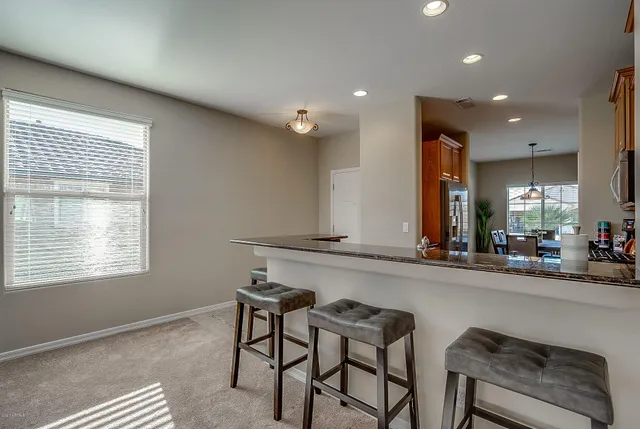 a view of a dining room with furniture window and outside view
