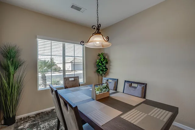 a view of a dining room with furniture window and outside view