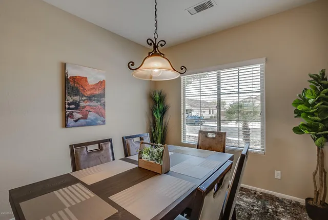 a kitchen with a refrigerator and a sink