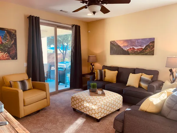 a bedroom with a large bed and a flat screen tv