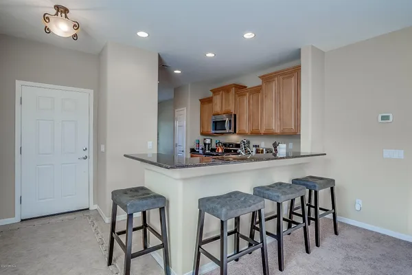 a kitchen with stainless steel appliances a stove a sink a stove and cabinets