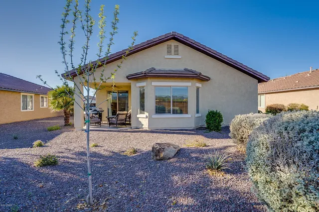a view of outdoor space with signage and flags