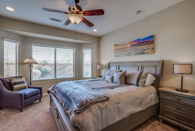 a bathroom with a double vanity sink a shower and a mirror