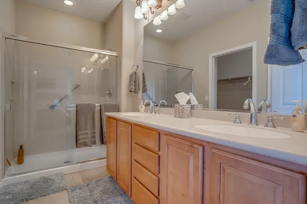 a bedroom with a bed and a lamp